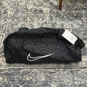 Nike Black Duffel Bag with Iconic Swoosh and Durable Design